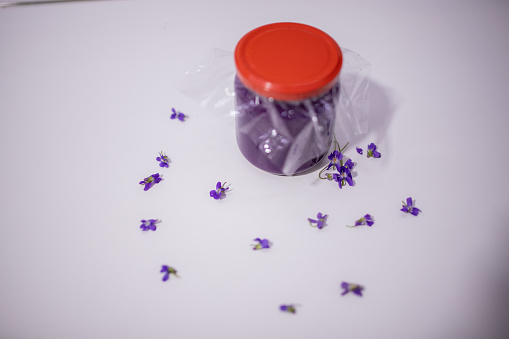 Sweet purple Viola wildflower jam on the table