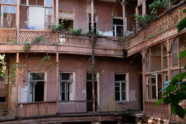 Photo of Interior courtyard of an abandoned apartment building in Old Town, Tbilisi, Georgia.