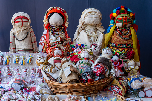 Close-up of a traditional amulet doll for sale to tourists at a street market in Kyiv, Ukraine. Ukrainian motanka dolls