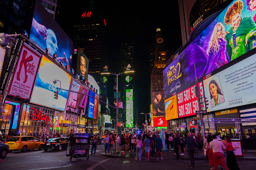 USA. New York. 09.25.2023. Night view of Times Square with a flurry of activity as pedestrians meander along Broadway, immersing themselves in the lively ambiance of New York City.