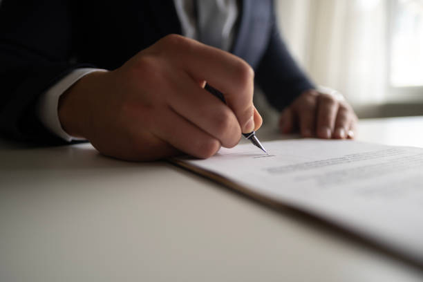 istock Businessman Signing Contract In The Office 2102571035