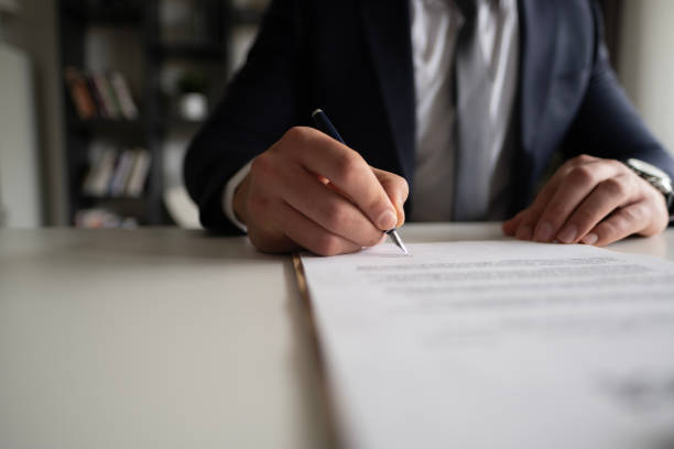 istock Businessman Signing Contract In The Office 2102571050