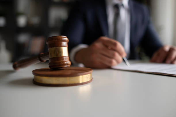 Judge or Legal advisor lawyer examining and signing legal documents. stock photo