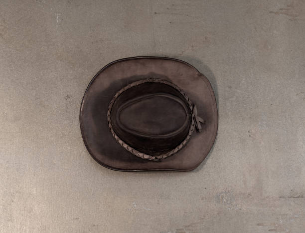 istock old leather cowboy hat on old background 2102595966