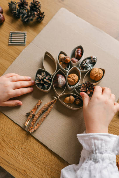 istock Montessori and Sensory Development, A child plays with natural materials 2102604064