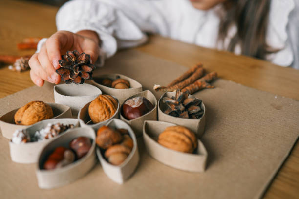 istock Montessori and Sensory Development, A child plays with natural materials 2102604072