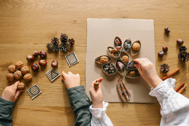 istock Montessori and Sensory Development, A child plays with natural materials 2102604084
