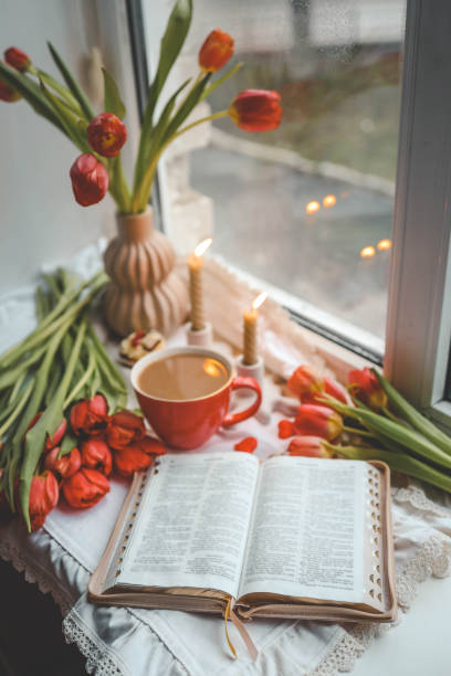 istock Open bible in home morning interior 2102604623