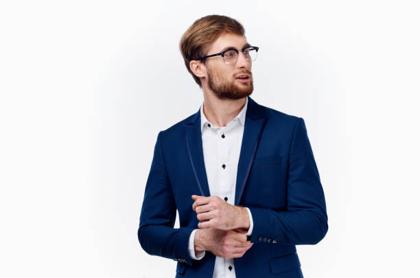 istock man in a blue jacket and glasses light shirt gesturing with his hands 2102613665