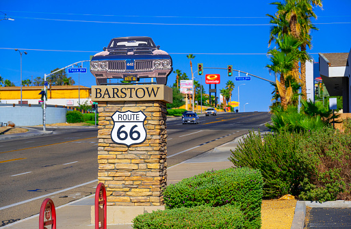 Barstow,  California, United States - October 10, 2023: The Main Street in Barstow, which is part of the old Route 66, has several pedestals with vintage cars on top. This one represent the state of Kansas.