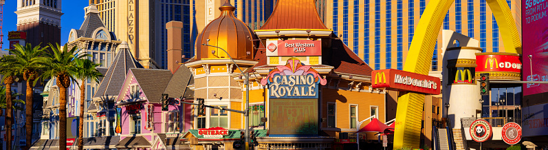 Las Vegas,  Nevada, United States - September 27, 2023: Casinos and Shops along the Las Vegas Strip in warm evening light