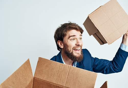 man with boxes in groups moving new place of work lifestyle official. High quality photo