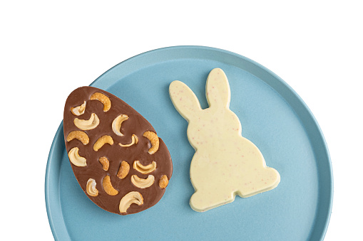 White chocolate with lemon and raspberry in the shape of a rabbit. And milk chocolate egg with cashew nuts.