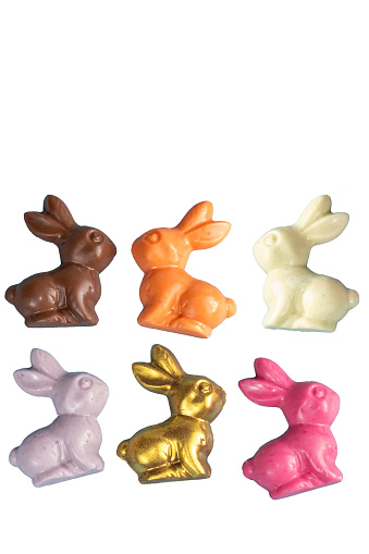 Small colorful milk chocolate and white chocolate bunnies.