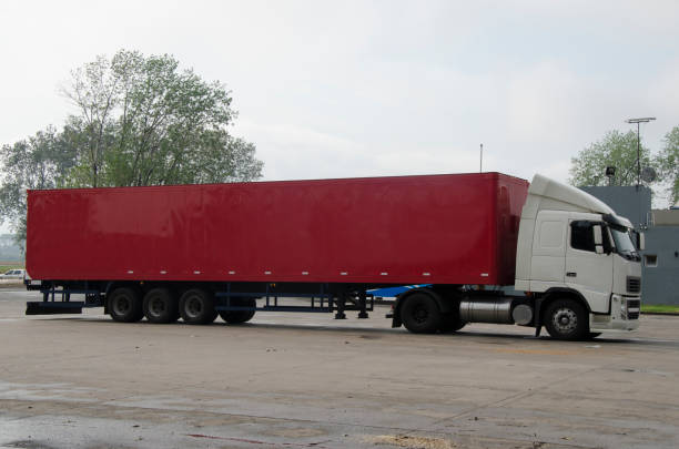 istock cargo truck with red canvas, ready to transport. 2102682943