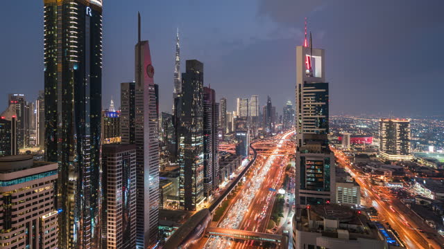 Dusk to Night Timelapse of Traffic and Skyscrapers Along Sheikh Zayed Road in Dubai, UAE, Zoom Out