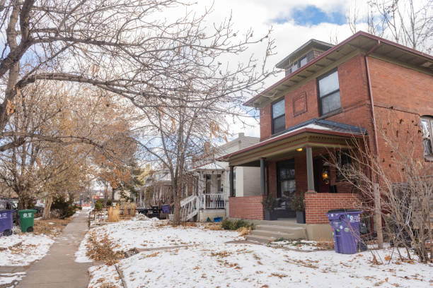 This is a photograph of colorful Western style houses in the historic Baker neighborhood in Denver, Colorado on a winter day.