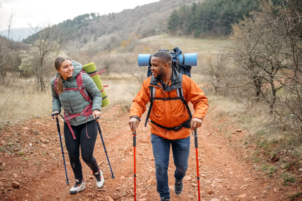 istock Young couple enjoying hiking in nature 2102731538