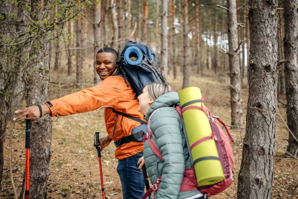 Two people living healthy lifestyle with hiking in nature