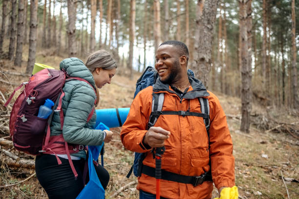 istock Young couple enjoying hiking in nature 2102732574