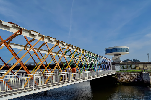 iron bridge, crosses the Avilés estuary. in the background Niemeyer Center.September 10, 2023