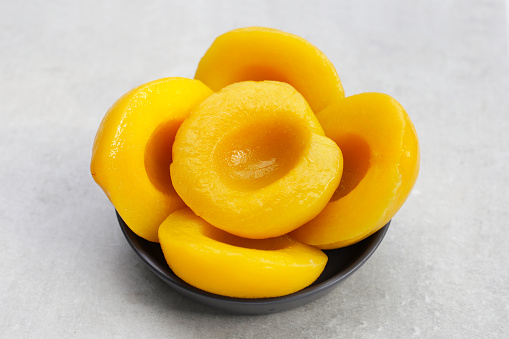 Peach halves in syrup. Fruity desserts