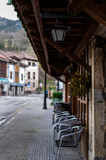 Charming rural streets in Cabrales Asturias lined with quaint café terraces showcasing local cuisine