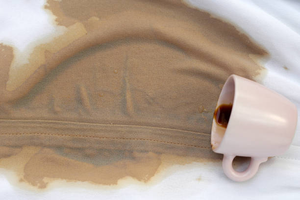 istock Dirty coffee stains on white clothes 2102788740