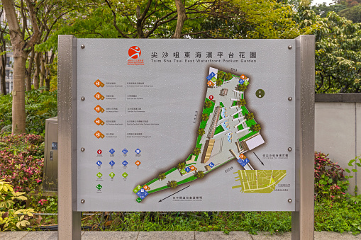 Hong Kong, China - April 27, 2017: Tourist Map Info of Tsim Sha Tsui East Waterfront Podium Garden Park Spring Rainy Day.