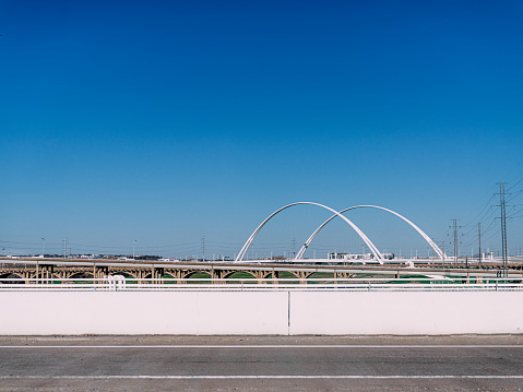 The Margaret McDermott Bridge, also known as the Dallas Signature Bridge, is an iconic cable-stayed bridge located in Dallas, Texas. It spans the Trinity River and serves as a key landmark in the city's skyline.