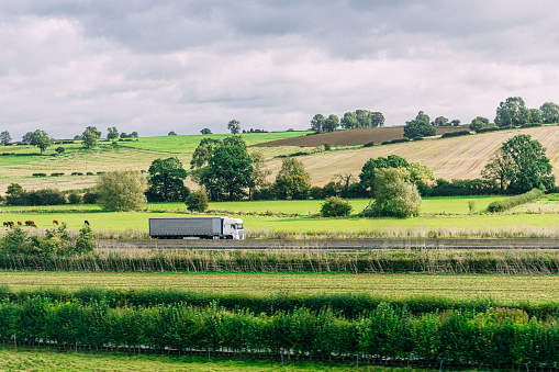 Semi Truck / Articulated Lorry Driving south in Rural United Kingdom near Buckinghamshire, Bedfordshire, Northamptonshire, and Warwickshire
