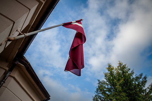 Picture of the latvian flag. The national flag of Latvia was used by independent Latvia from 1918 until the country was occupied by the Soviet Union in 1940. Its use was suppressed during Soviet rule. On 27 February 1990, shortly before the country regained its independence, the Latvian government re-adopted the traditional red-white-red flag.