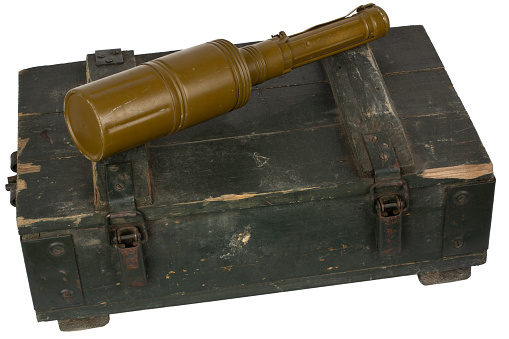 RKG-3 Soviet anti-tank handheld shaped-charge grenade on green ammo crate.
