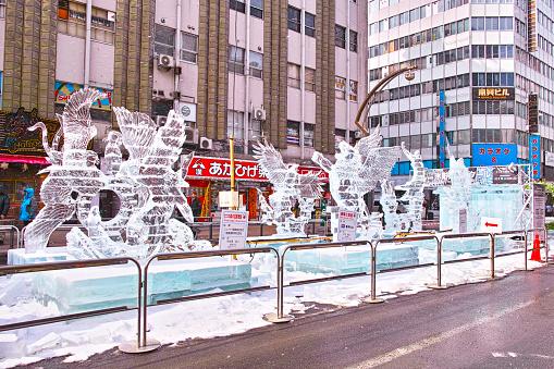 Sapporo, Hokkaido, Japan - February 9, 2024: Ice sculpture scenery at the Susukino venue of the Sapporo Snow Festival.