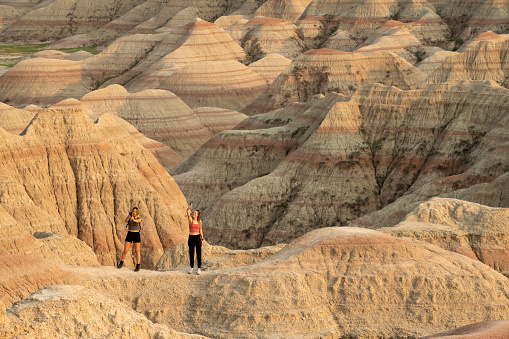 Interior, USA - June 14, 2023. Two young ladies taking selfie at Badlands National Park, South Dakota, USA