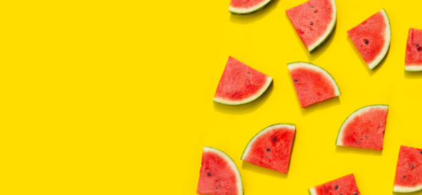istock Watermelon slices on yellow background. 2102960414