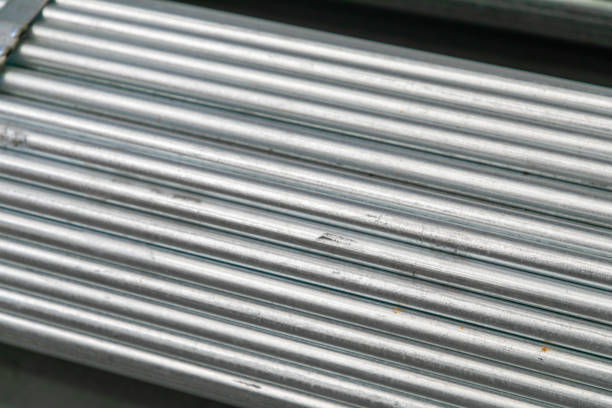 Abstract close up of a stack of steel pipes.