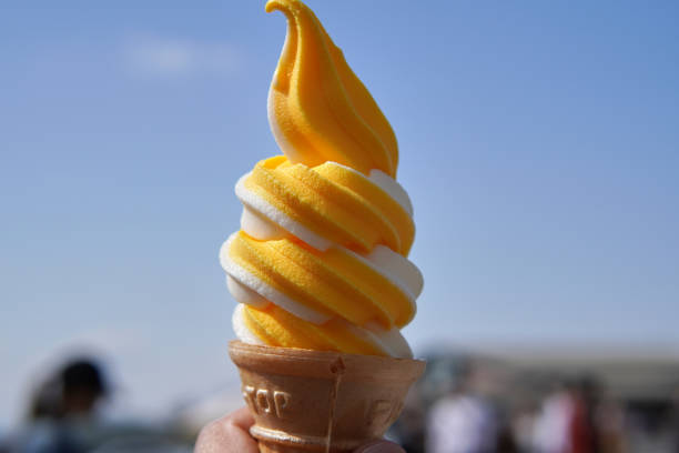 Mixed soft serve ice cream with blue sky in the background.