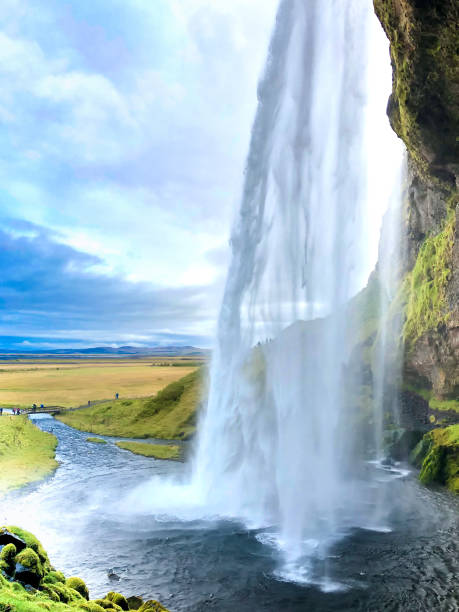 istock Iceland: Seljalandsfoss Waterfall, Tourists in Distance Apporaching 2103023816