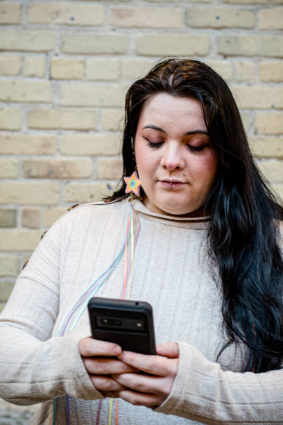 istock Tech Savvy Identity: Indigenous LGBT Woman Embracing Modernity 2103030967
