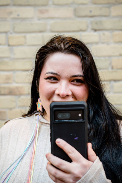 istock Tech Savvy Identity: Indigenous LGBT Woman Embracing Modernity 2103030986