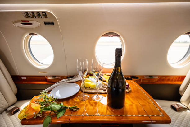 istock Flower and Wine on Table of Private Jet Cabin 2103032682