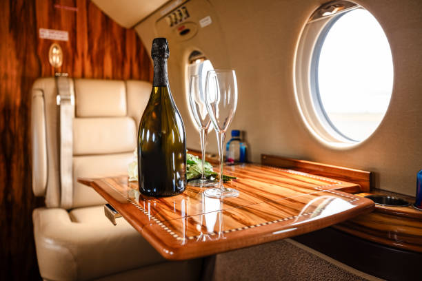 istock Champagne and Flowers on Table on Private Jet 2103032687
