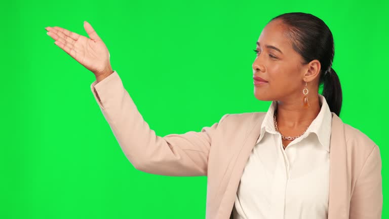 Woman, presentation and point at green screen, face or list business info for opportunity of offer on studio background. News, announcement and mockup space, female professional and advertising menu