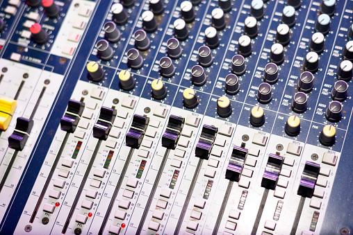 Close-up of sound mixer in recording studio.