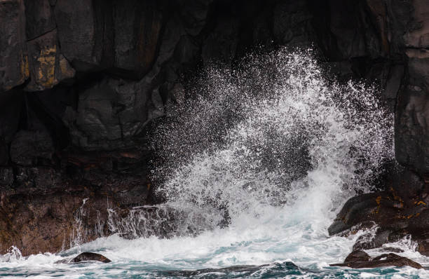 istock The moment the waves hit the coastal cliff. bubbles, splash 2103133006