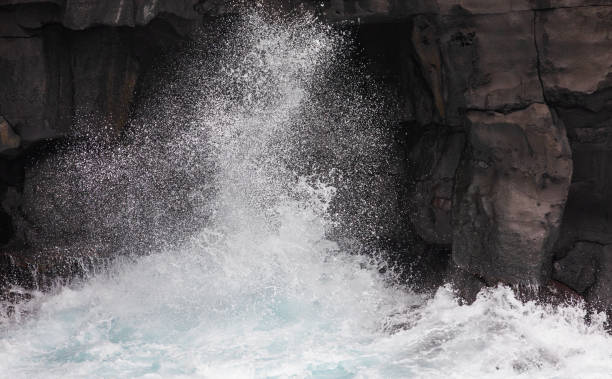 istock The moment the waves hit the coastal cliff. bubbles, splash 2103134042