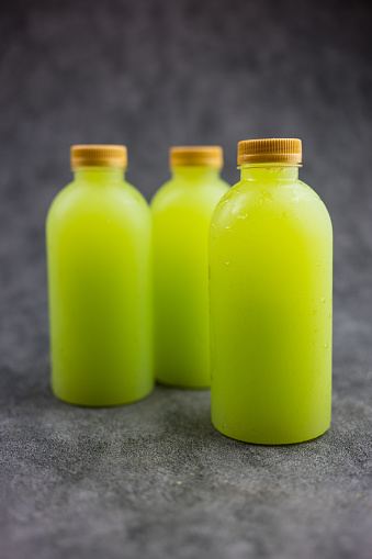 Guava juice in plastic bottle with golden lid