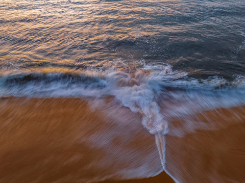 Top down sunrise with a rip at North Pearl Beach on the Central Coast, NSW, Australia.