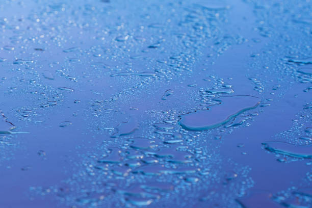 Large and small water droplets on the iron plate